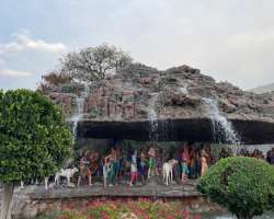 It looks magnificent in the evening time with shin It looks magnificent in the evening time with shiny bright lights. The sound of fountain present in the garden excites the visitors. The location is p
